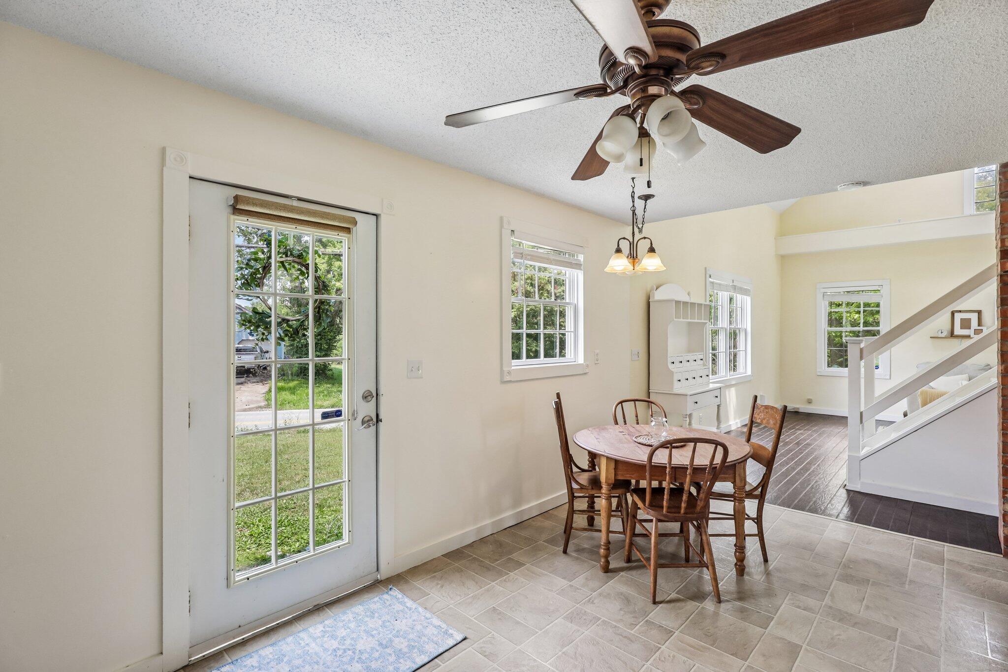 12022 Klein Road Morning View, KY 41063 - Photo 9 of 31 Dining area featuring tiled flooring, a glass-paned exterior door, and a ceiling fan with integrated lighting