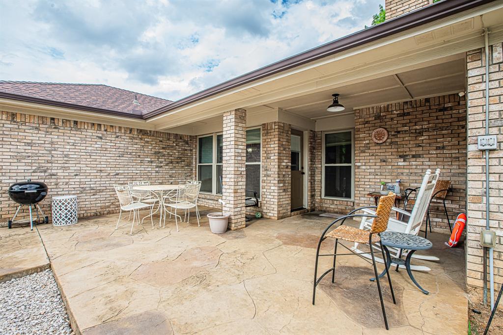 3309 Timber View Circle Bedford, TX 76021 - Photo 32 of 38 a view of a patio with couple of chairs and a couch