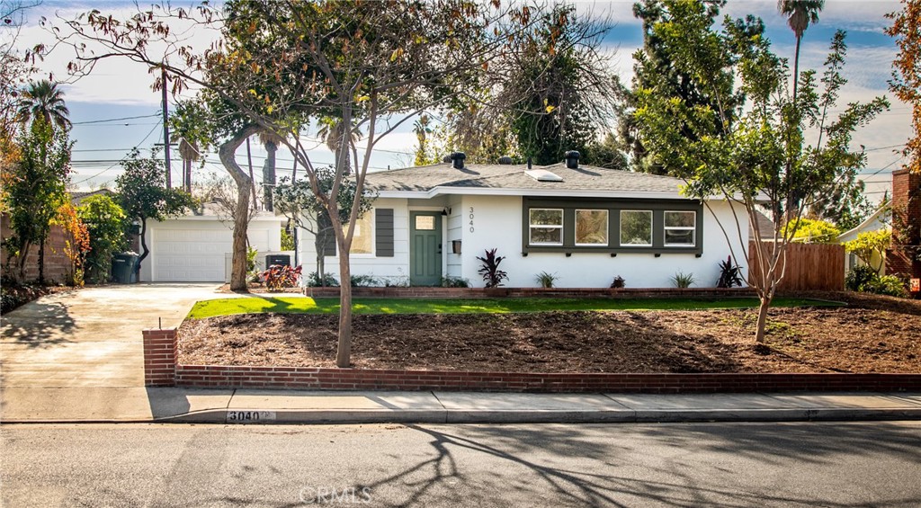 3040 Cimarron Road Riverside, CA 92506 - Photo 1 of 1 a view of a house with a yard and large tree