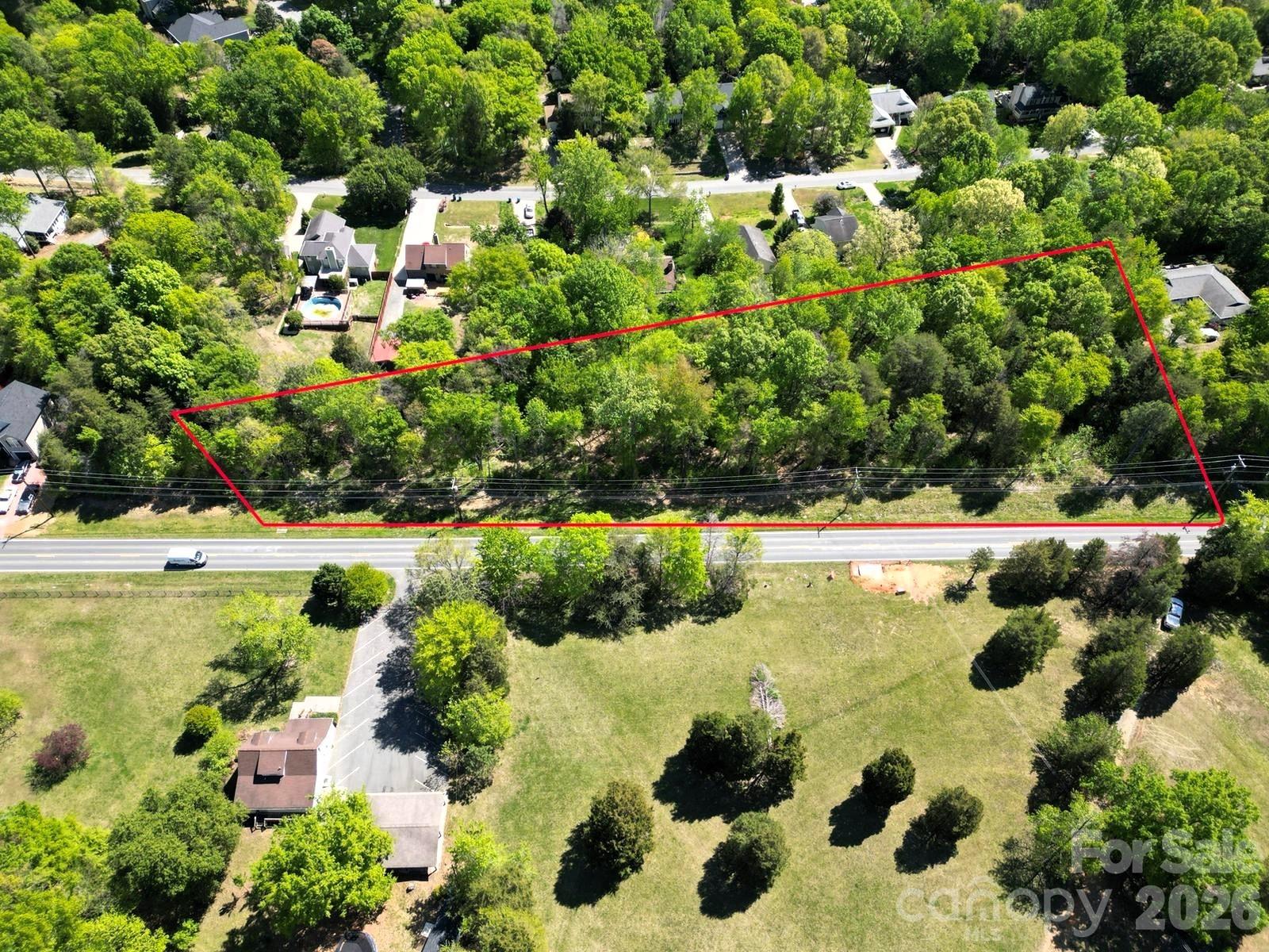 13075 Plaza Rd Extension Charlotte, NC 28215 - Photo 1 of 25 a view of a garden with a lake