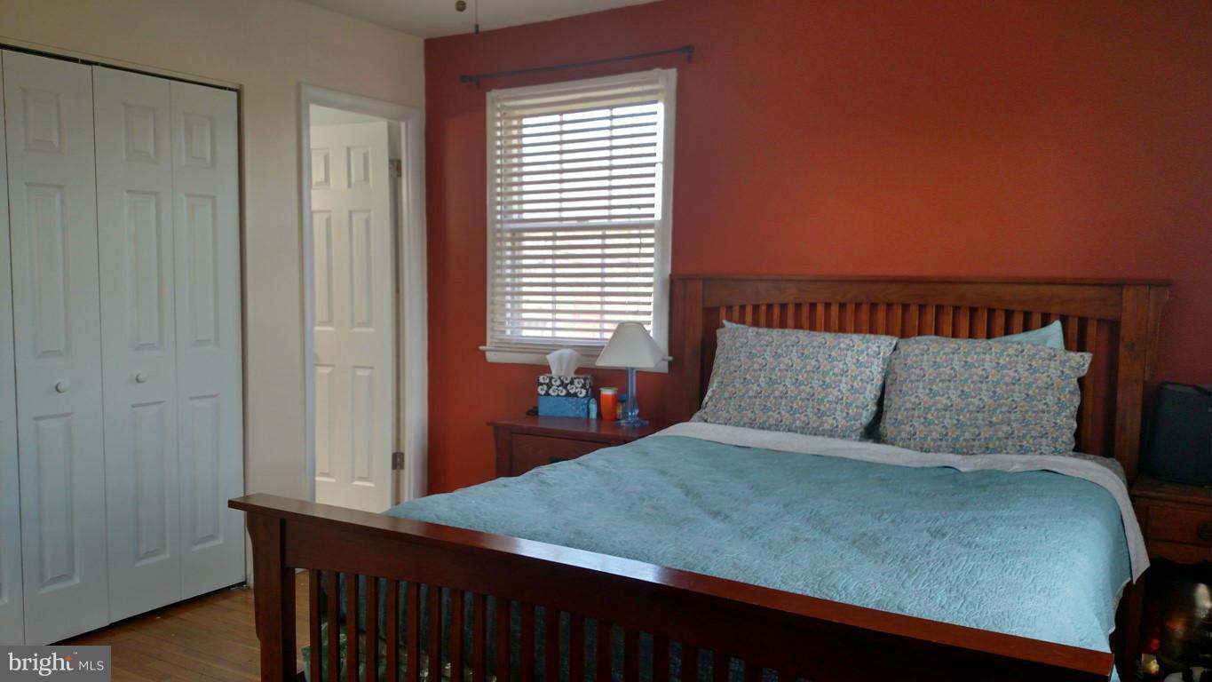 6304 Magdolena Road Baltimore, MD 21237 - Photo 15 of 26 a bedroom with a bed and a window