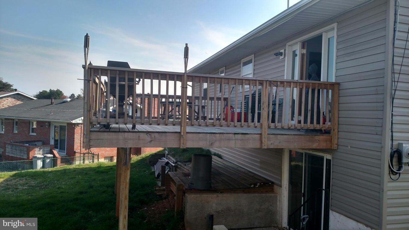 6304 Magdolena Road Baltimore, MD 21237 - Photo 3 of 26 a balcony with table and chairs