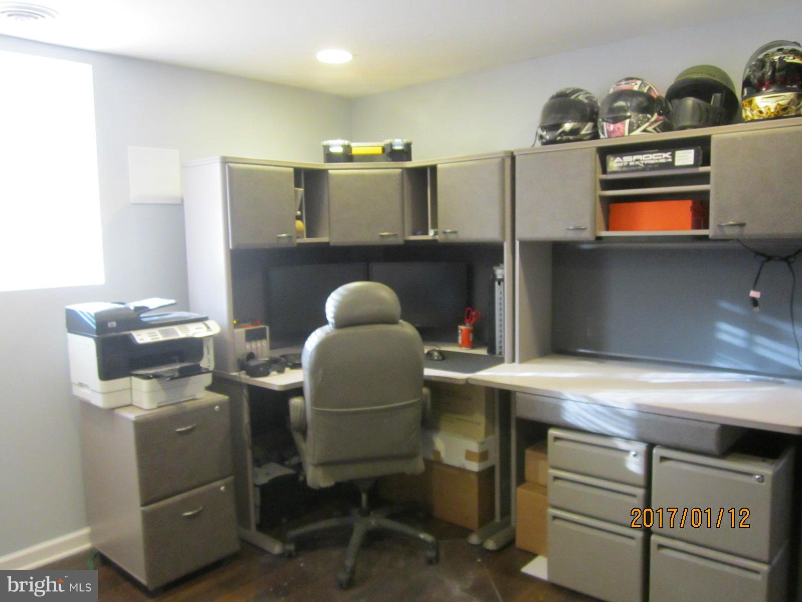 6304 Magdolena Road Baltimore, MD 21237 - Photo 24 of 26 a room with a cabinets and window