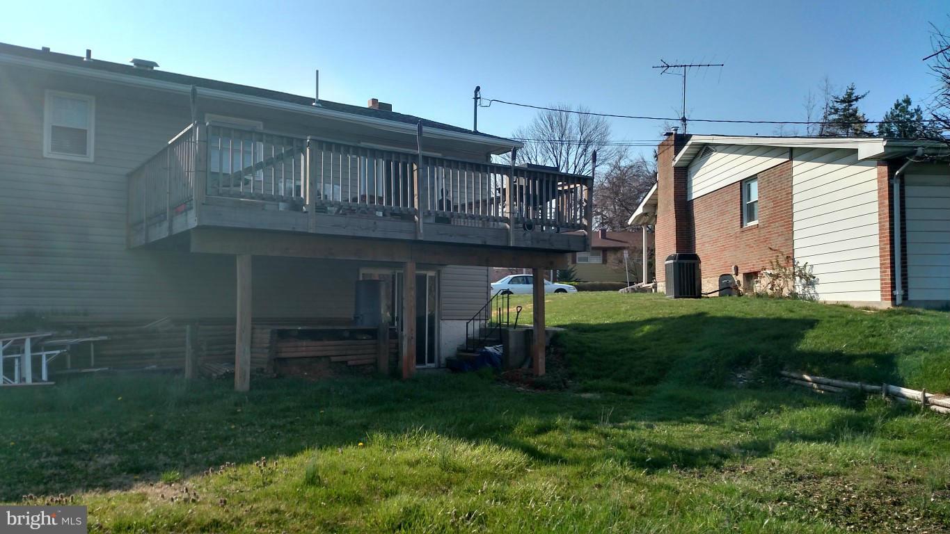 6304 Magdolena Road Baltimore, MD 21237 - Photo 4 of 26 a house view with a garden space