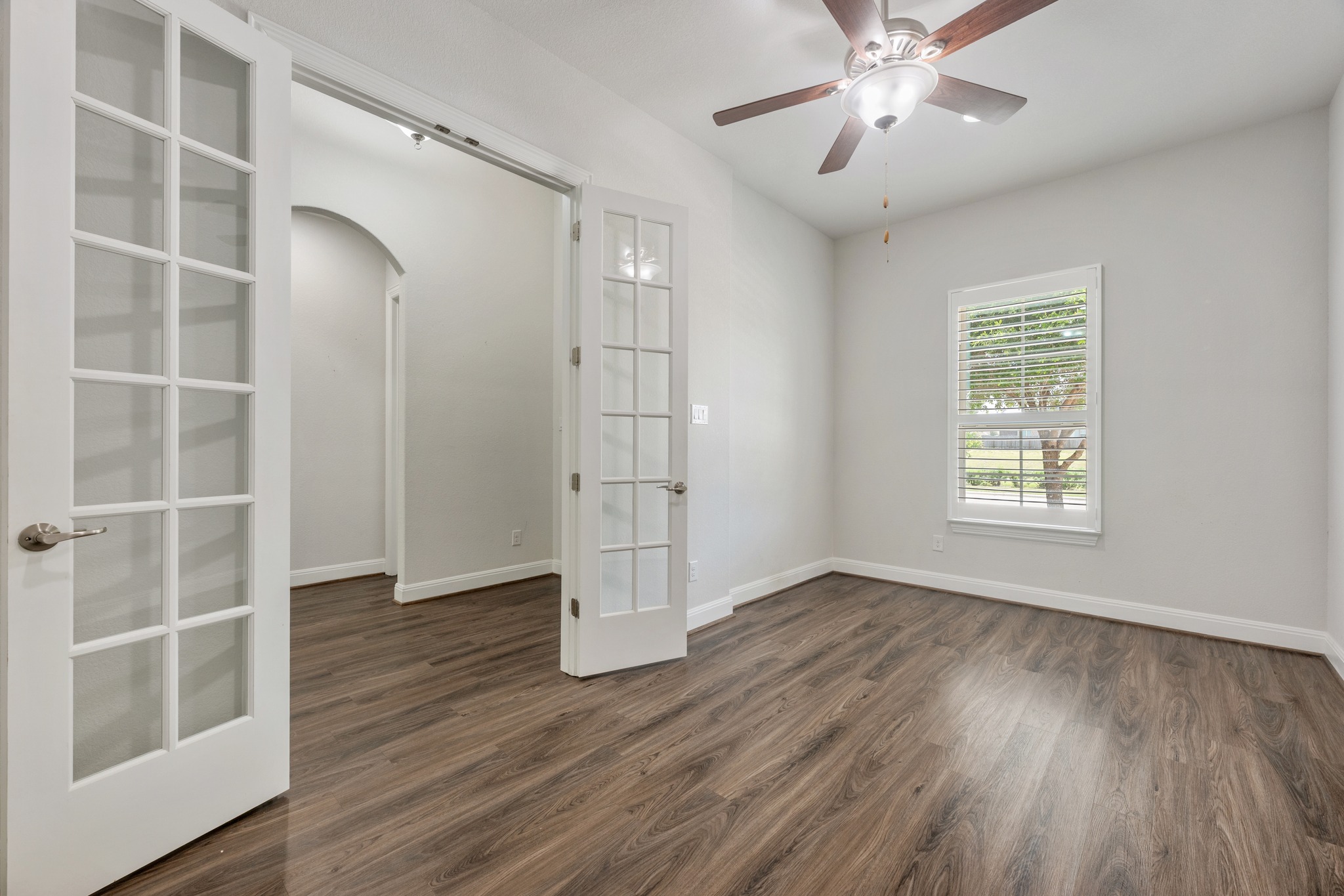 2709 Steece Way Leander, TX 78641 - Photo 21 of 39 a view of an empty room with wooden floor and a window