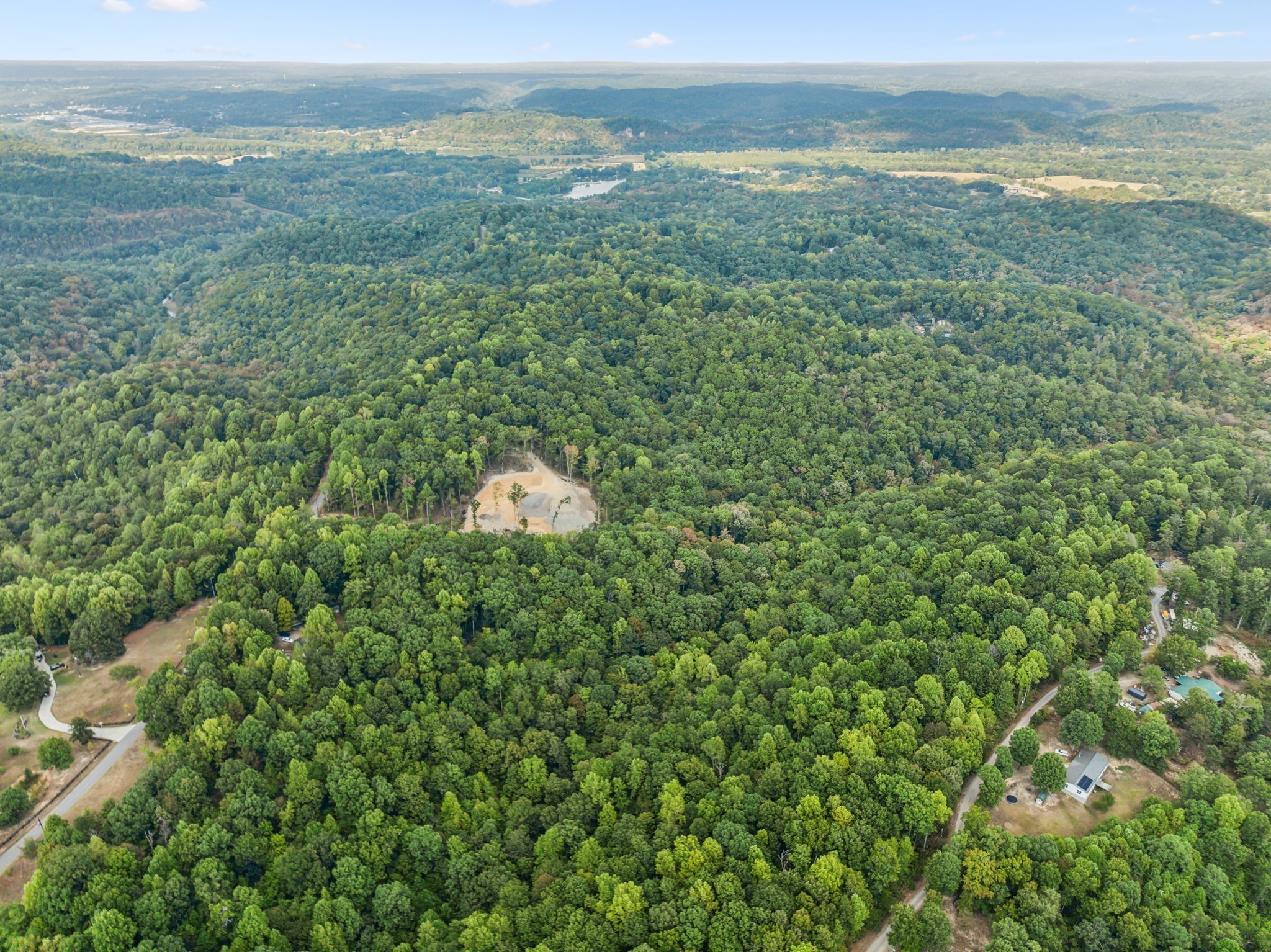 0 Gibbs Road Ashland City, TN 37015 - Photo 19 of 23 a view of a field with an ocean and trees in the background