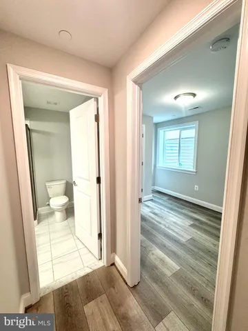 a view of a bathroom from a hallway