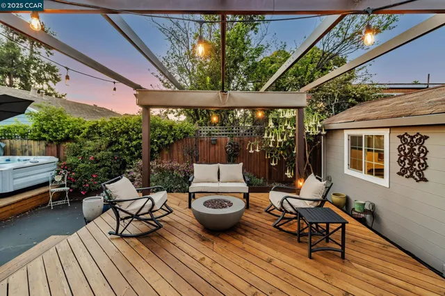 a view of a patio with couple of chairs and a couch