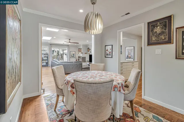 a living room with furniture flat screen tv and a large window