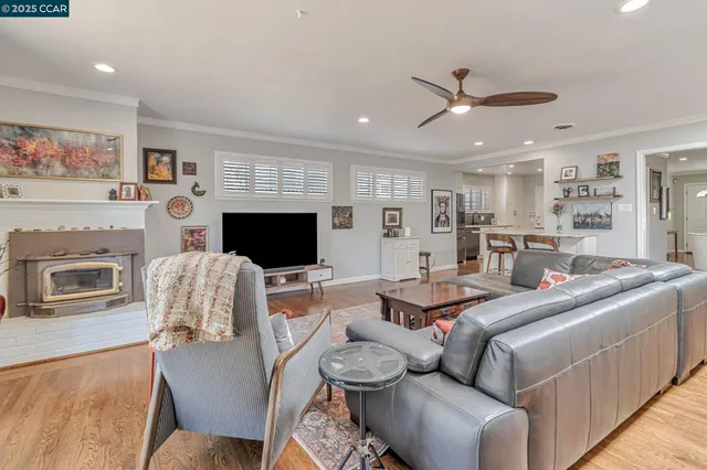 a bedroom with furniture and a flat screen tv