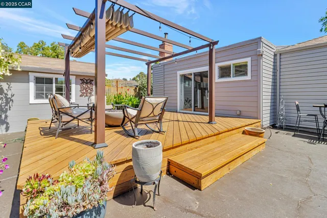 a view of swimming pool with outdoor seating