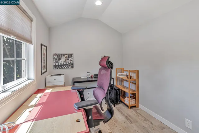 a view of a bedroom with bed and hallway