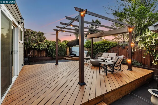 a view of backyard with sitting area
