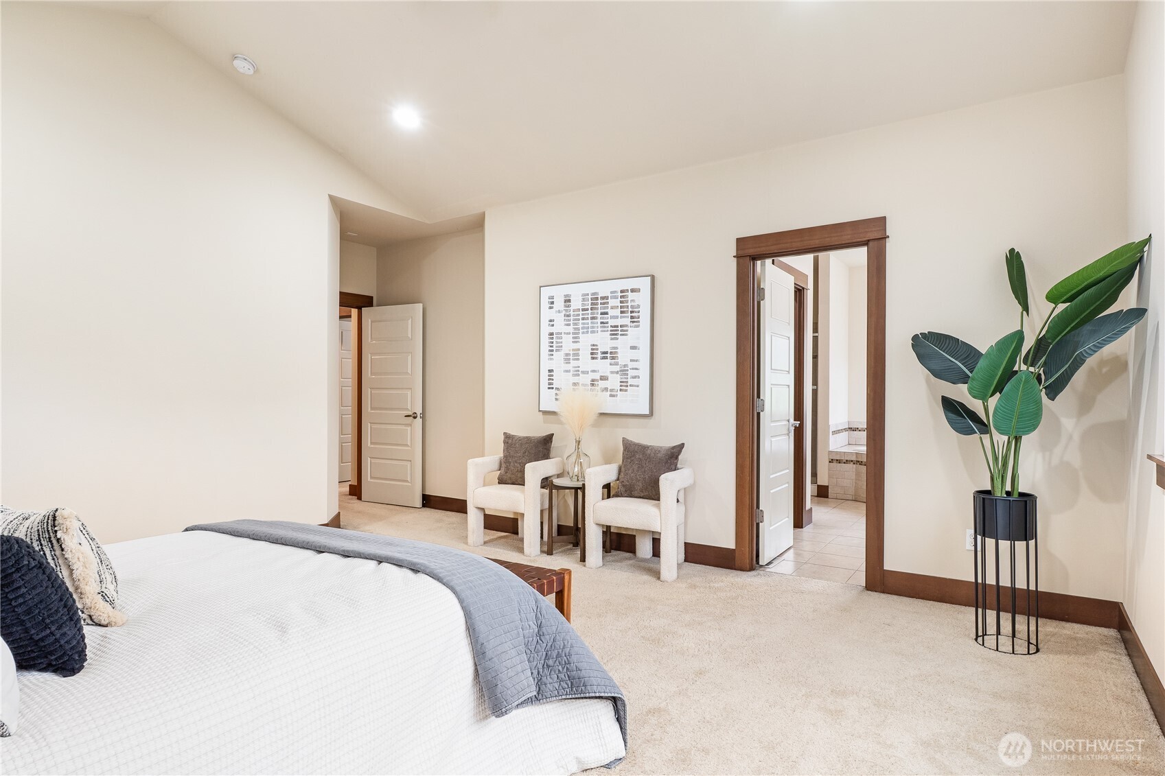 20304 3rd Drive Southeast Bothell, WA 98012 - Photo 24 of 31 a spacious bedroom with a bed and a potted plant