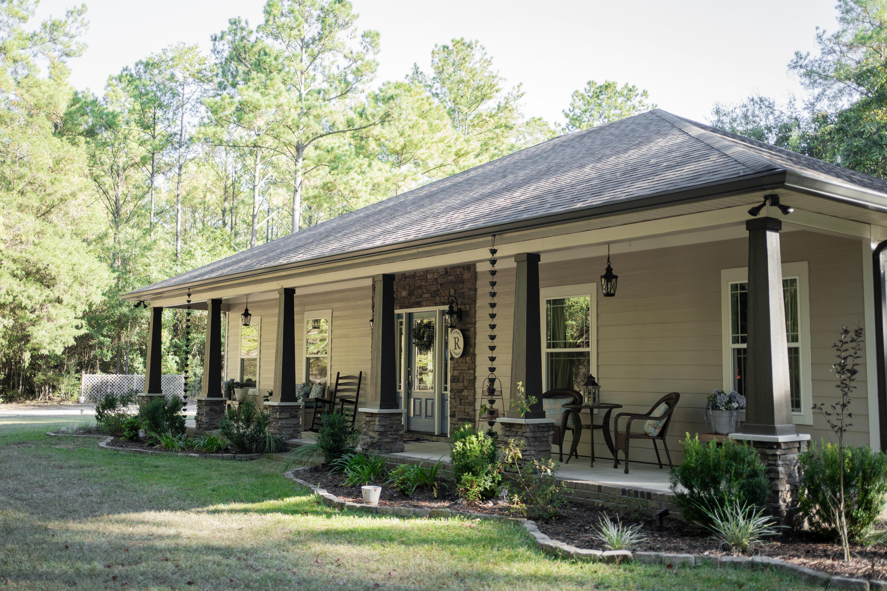 5485 Old River Road Baker, FL 32531 - Photo 1 of 48 a front view of house with yard and outdoor seating