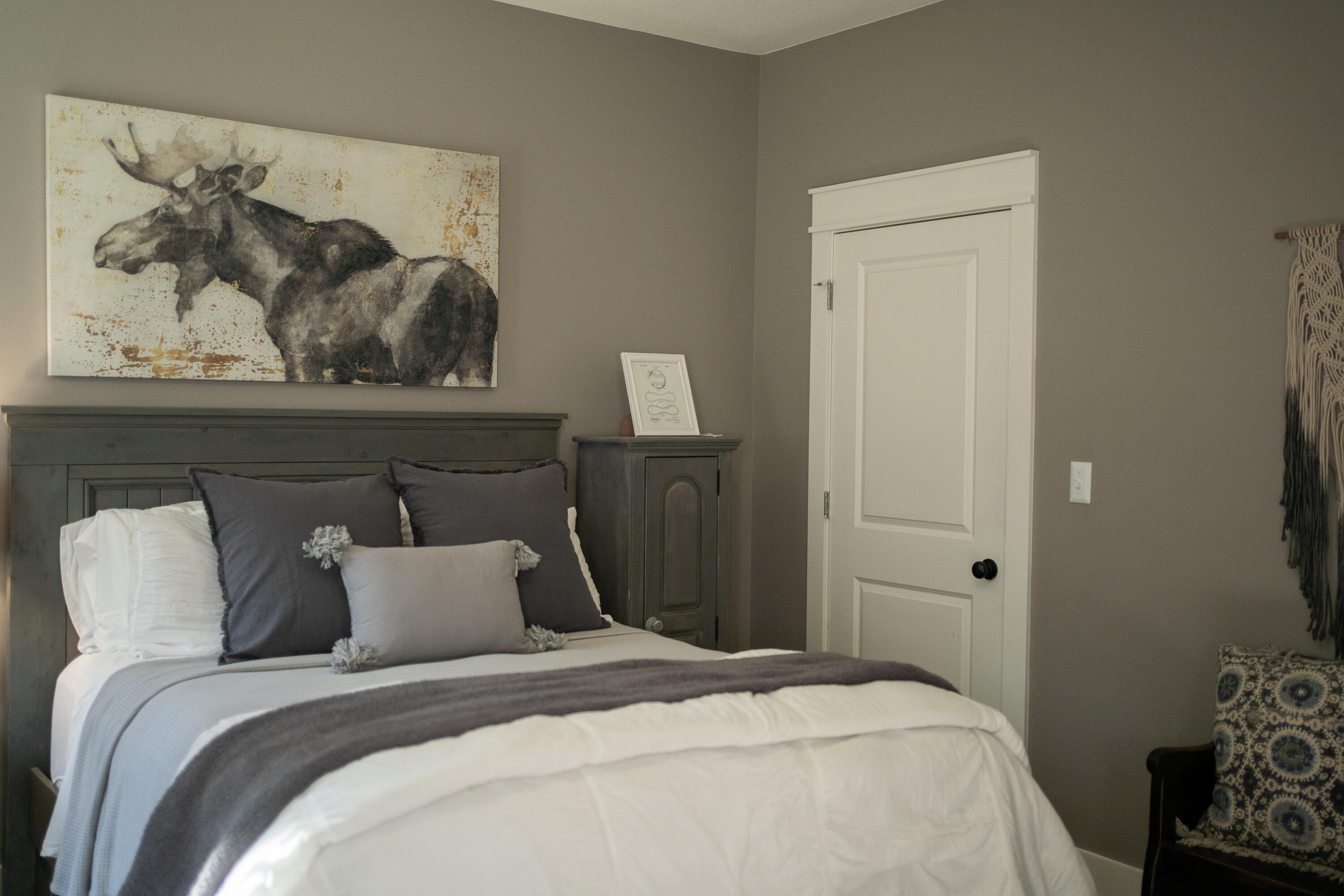 5485 Old River Road Baker, FL 32531 - Photo 24 of 48 a bedroom with bed and wall painting