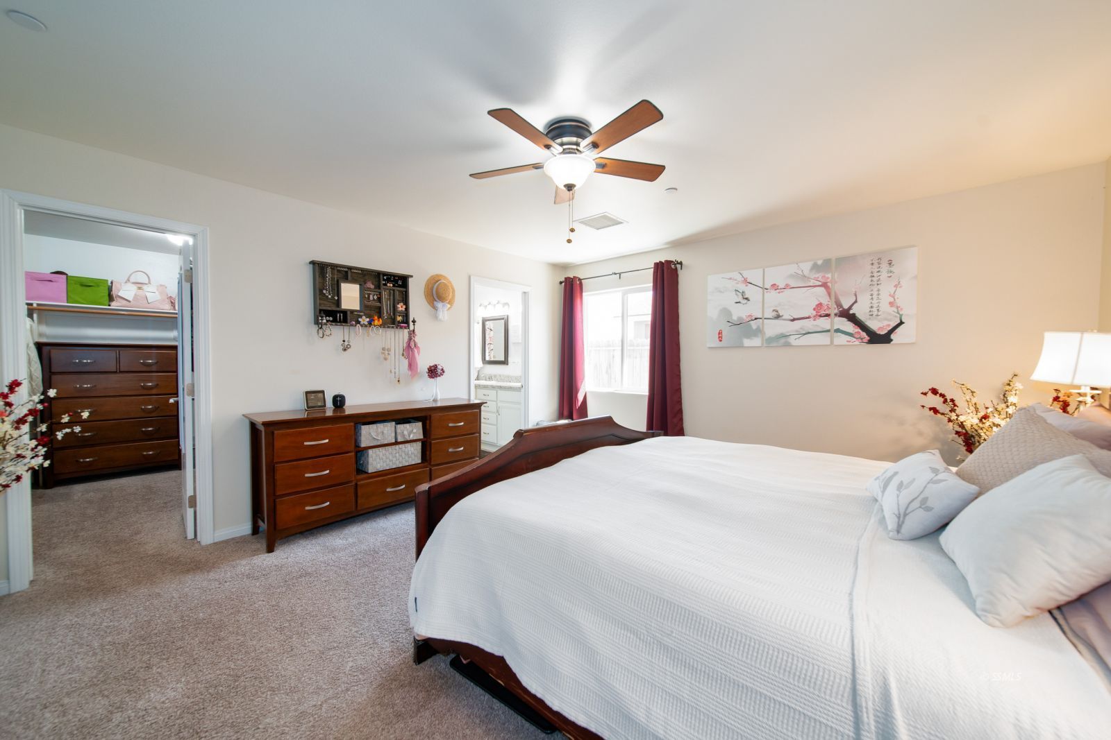 1540 Mayo Street Ridgecrest, CA 93555 - Photo 19 of 32 a bedroom with a bed and a dresser