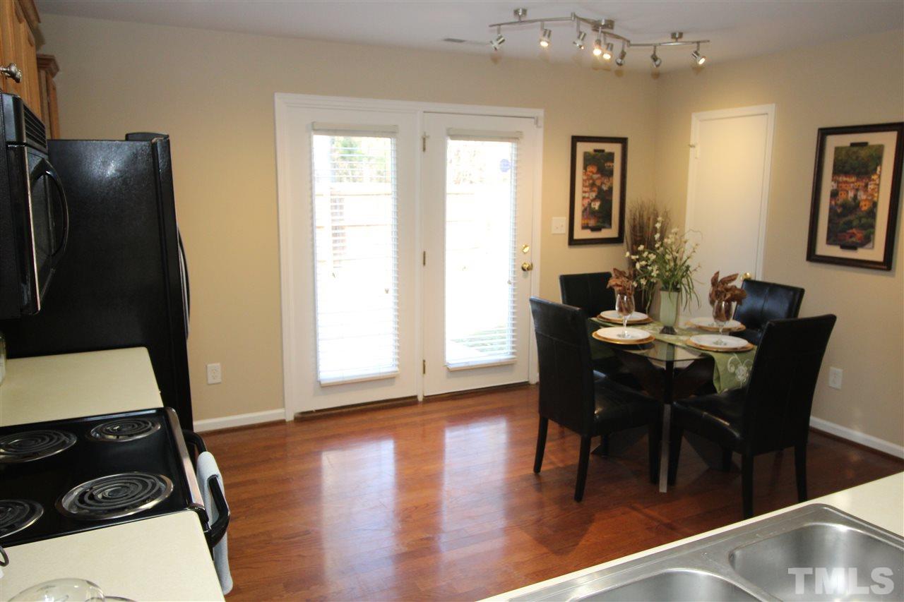 2411 Quarry Ridge Lane Raleigh, NC 27610 - Photo 11 of 22 a view of a dining room with furniture and wooden floor