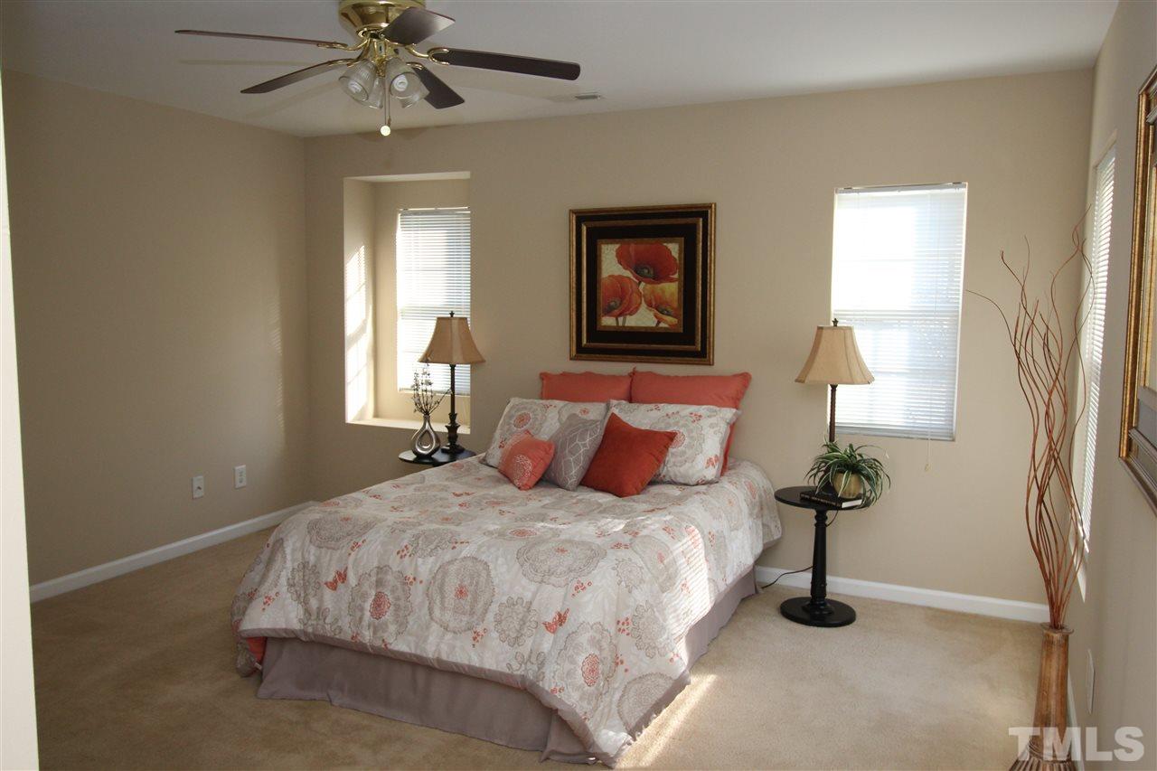 2411 Quarry Ridge Lane Raleigh, NC 27610 - Photo 14 of 22 a bedroom with a bed and a window