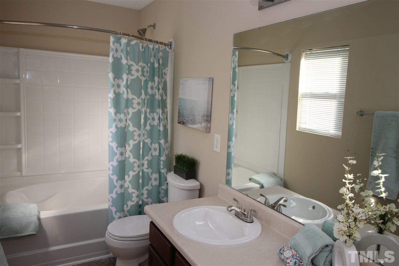 2411 Quarry Ridge Lane Raleigh, NC 27610 - Photo 16 of 22 a bathroom with a sink toilet and shower
