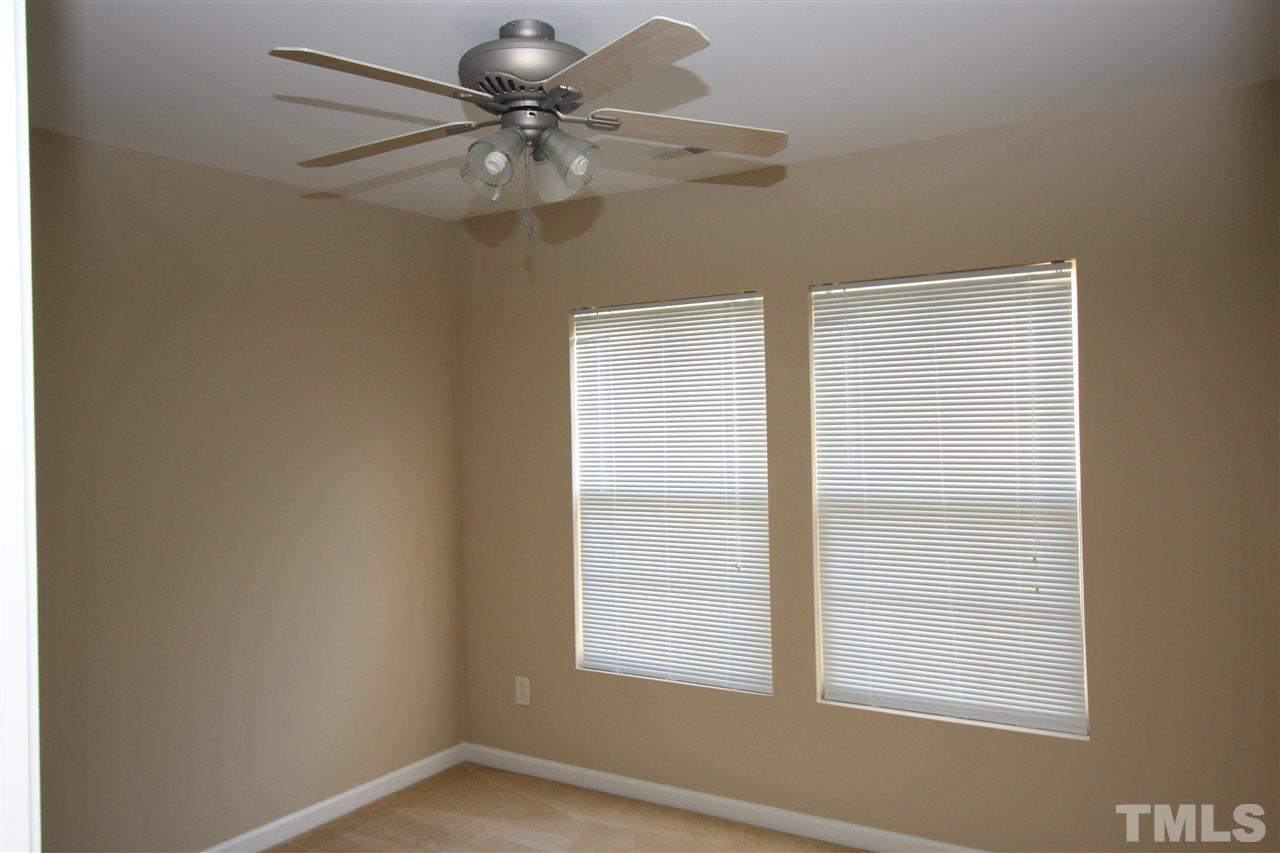 2411 Quarry Ridge Lane Raleigh, NC 27610 - Photo 18 of 22 a view of an empty room with a window