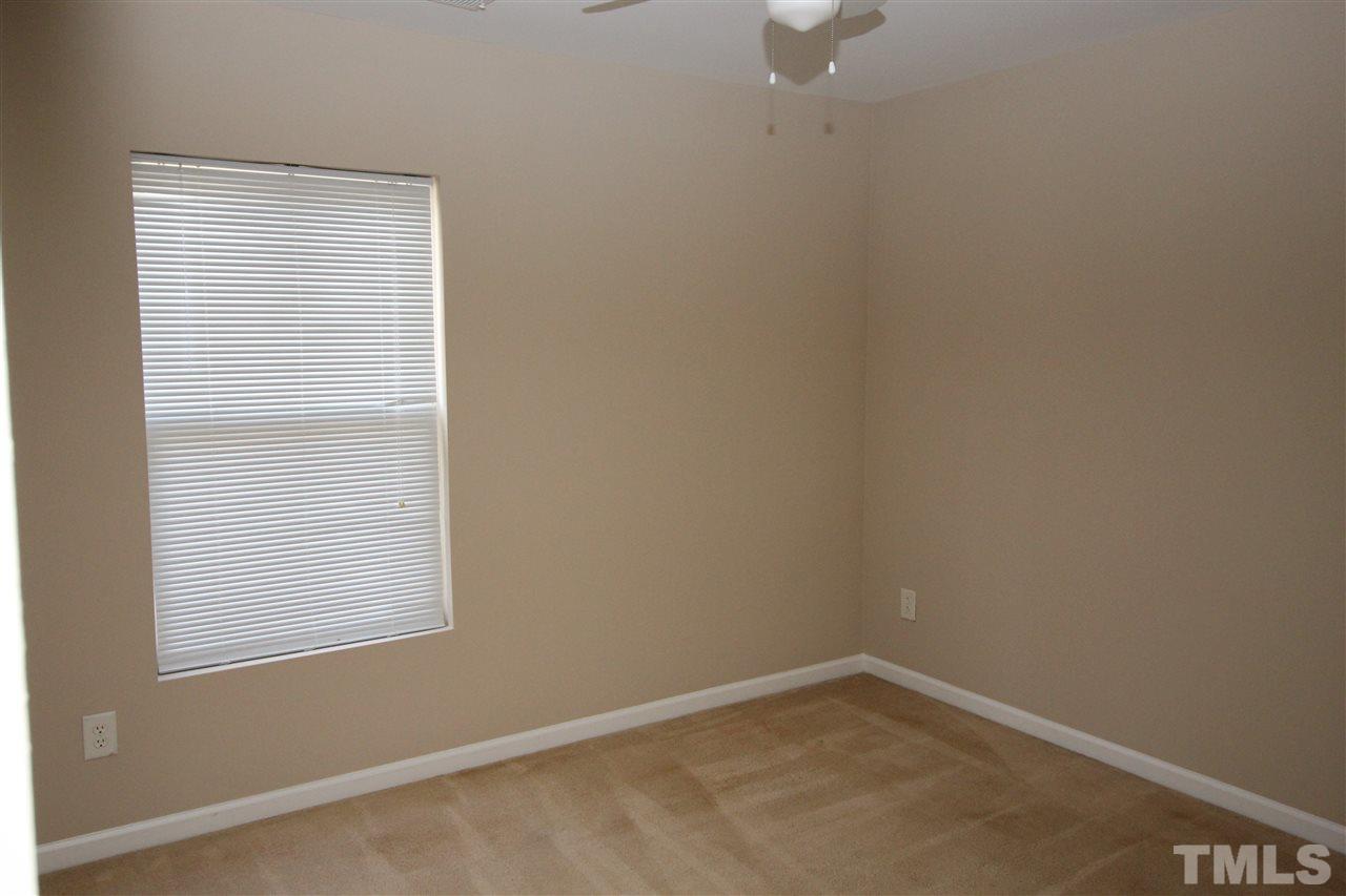 2411 Quarry Ridge Lane Raleigh, NC 27610 - Photo 20 of 22 a view of an empty room with a window