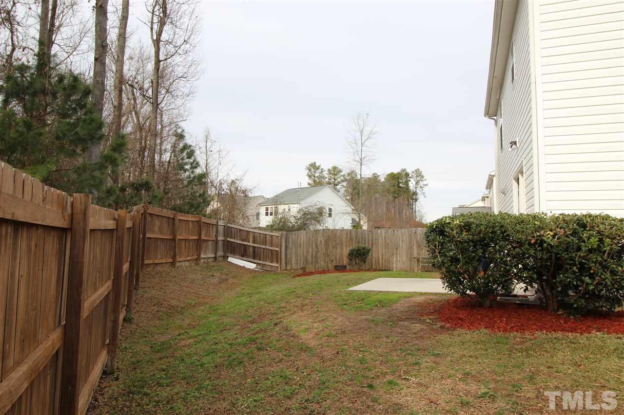 2411 Quarry Ridge Lane Raleigh, NC 27610 - Photo 4 of 22 a view of a house with backyard and garden