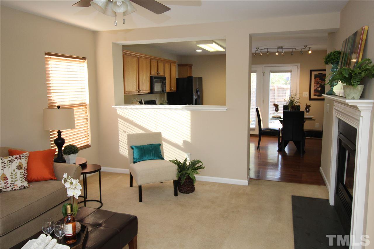 2411 Quarry Ridge Lane Raleigh, NC 27610 - Photo 7 of 22 a living room with furniture and a fireplace