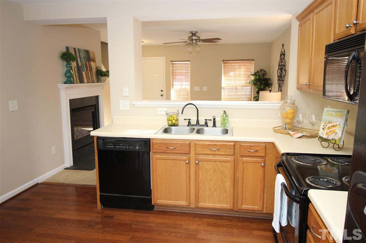 2411 Quarry Ridge Lane Raleigh, NC 27610 - Photo 10 of 22 a kitchen with a sink appliances and cabinets