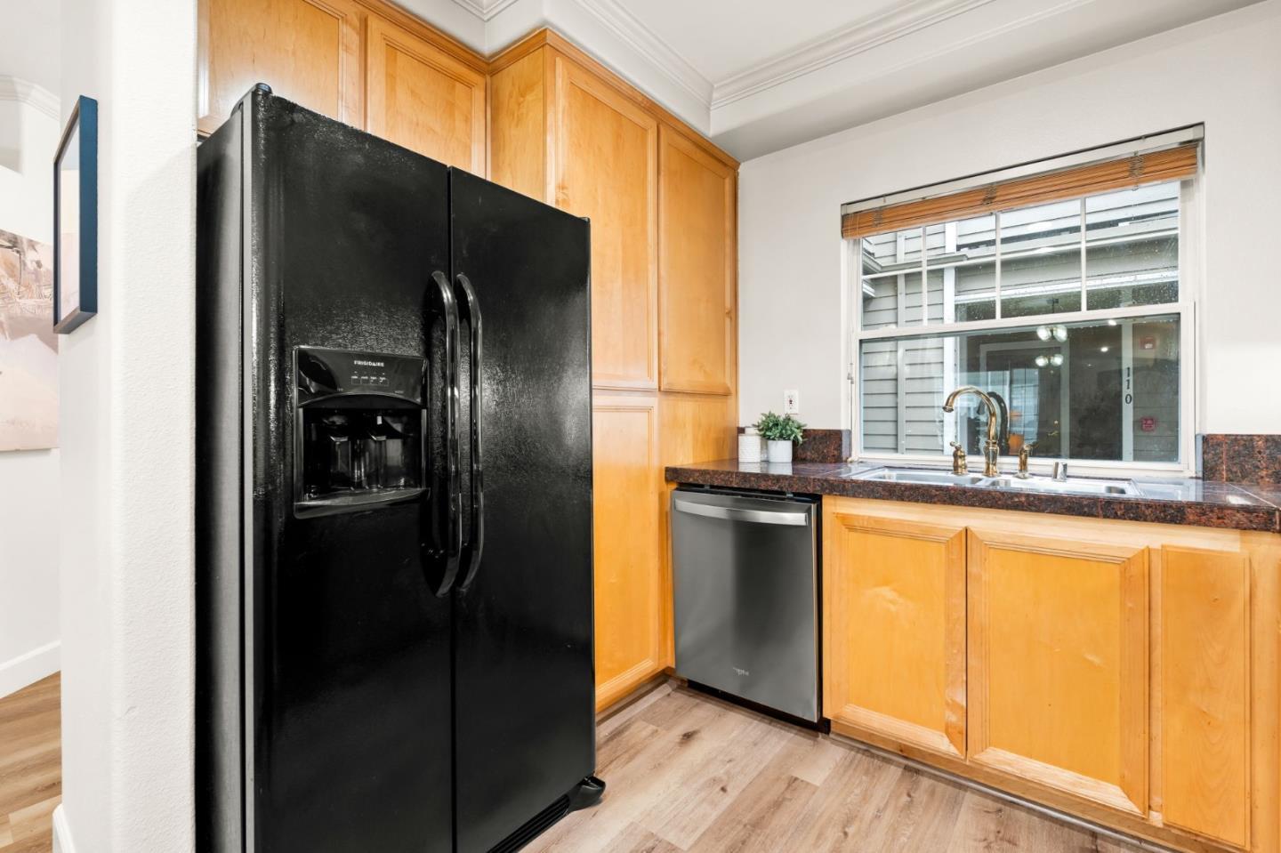 852 Diablo Avenue, Unit 104 Novato, CA 94947 - Photo 12 of 23 a kitchen with stainless steel appliances granite countertop a refrigerator and a sink