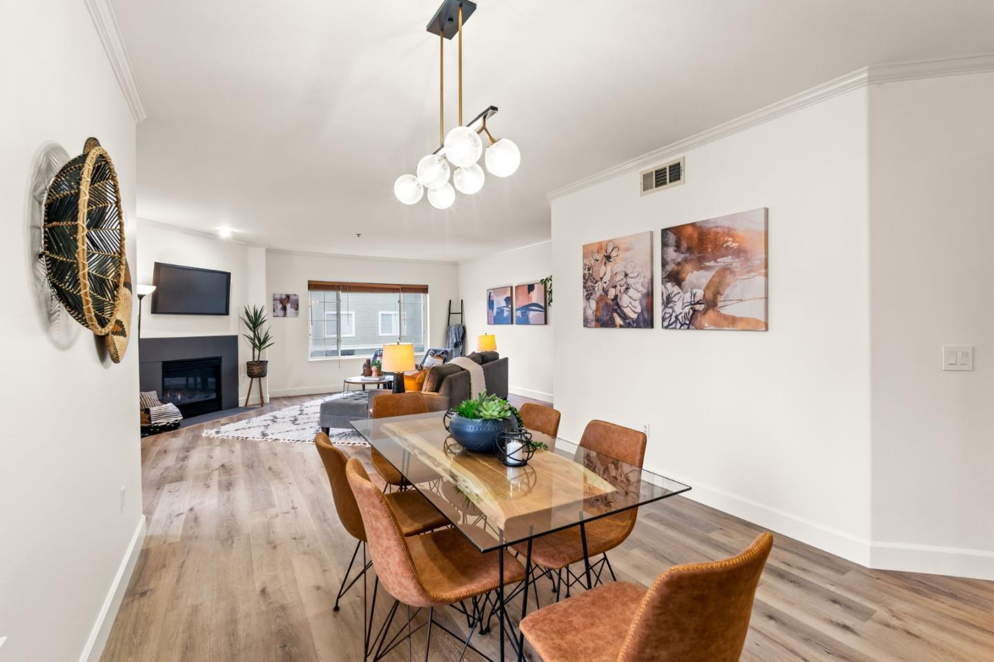 852 Diablo Avenue, Unit 104 Novato, CA 94947 - Photo 6 of 23 a living room with furniture a fireplace and a flat screen tv