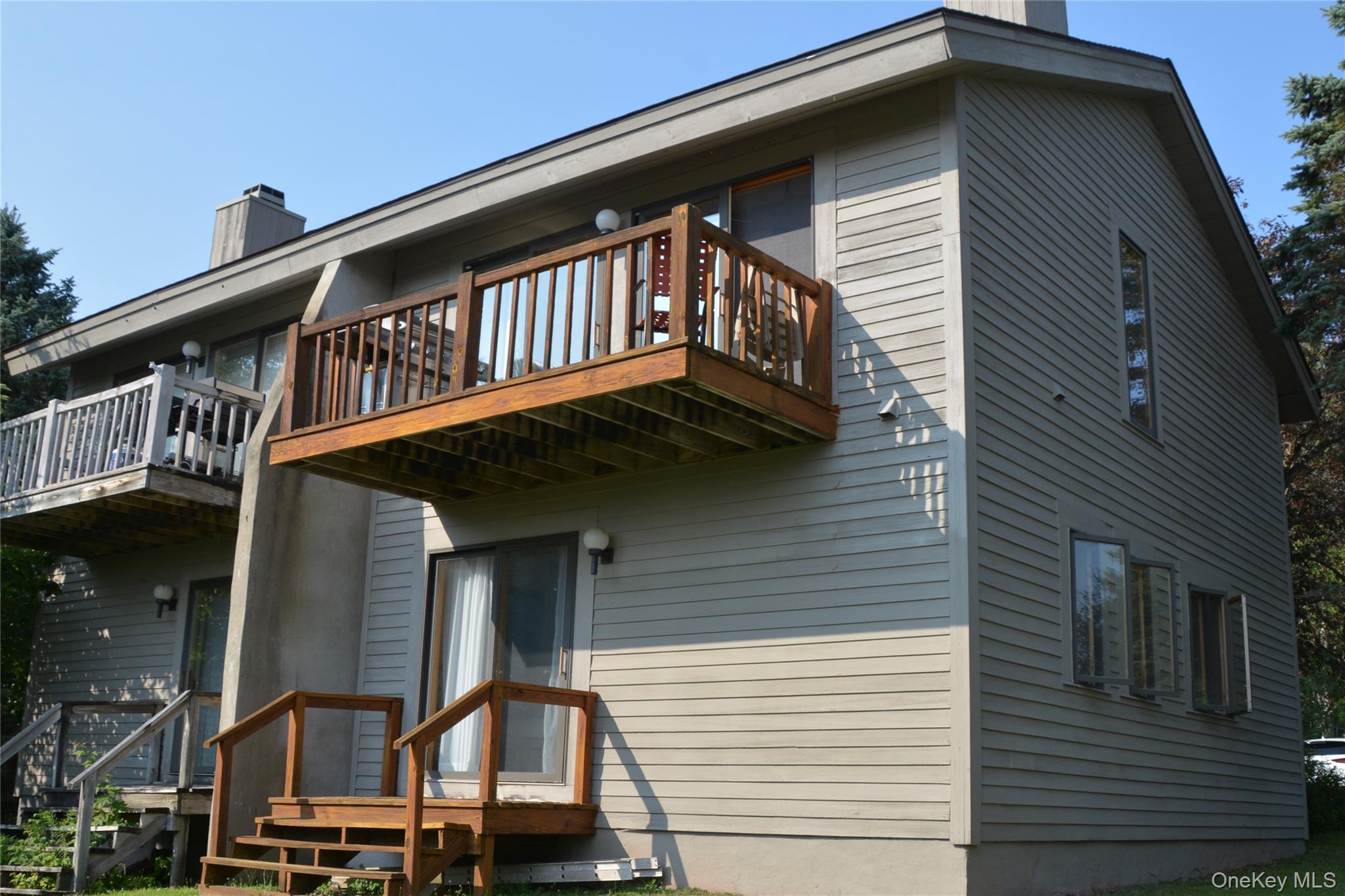 79 Windham Ridge Road, Unit 17A Windham, NY 12496 - Photo 2 of 18 a front view of a house with a balcony