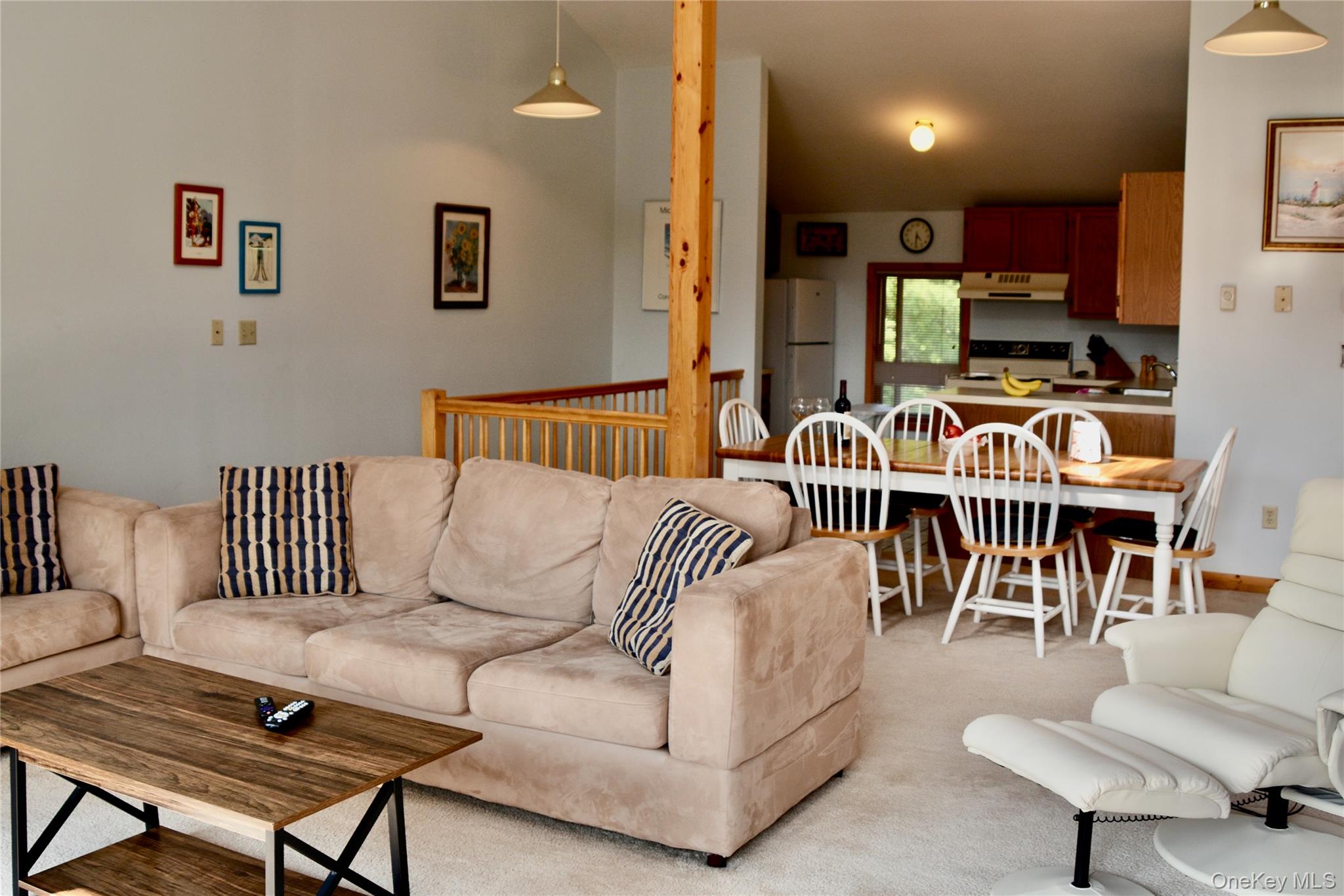 79 Windham Ridge Road, Unit 17A Windham, NY 12496 - Photo 6 of 18 a living room with furniture kitchen view and a wooden floor