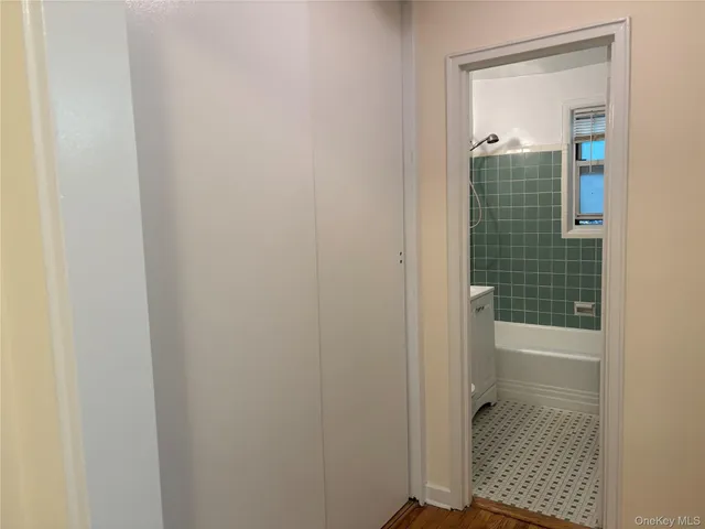 a bathroom with a glass shower door