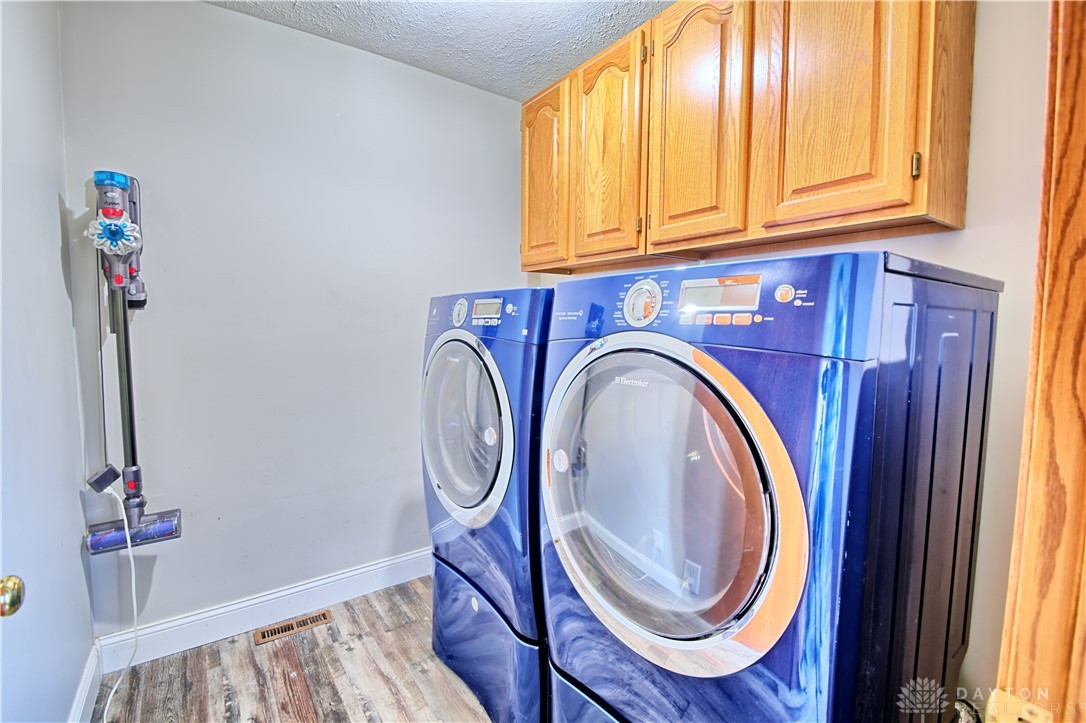 8711 Nicole Lane Springboro, OH 45066 - Photo 61 of 87 This dedicated laundry space combines functionality with sleek design, featuring modern appliances and practical storage.