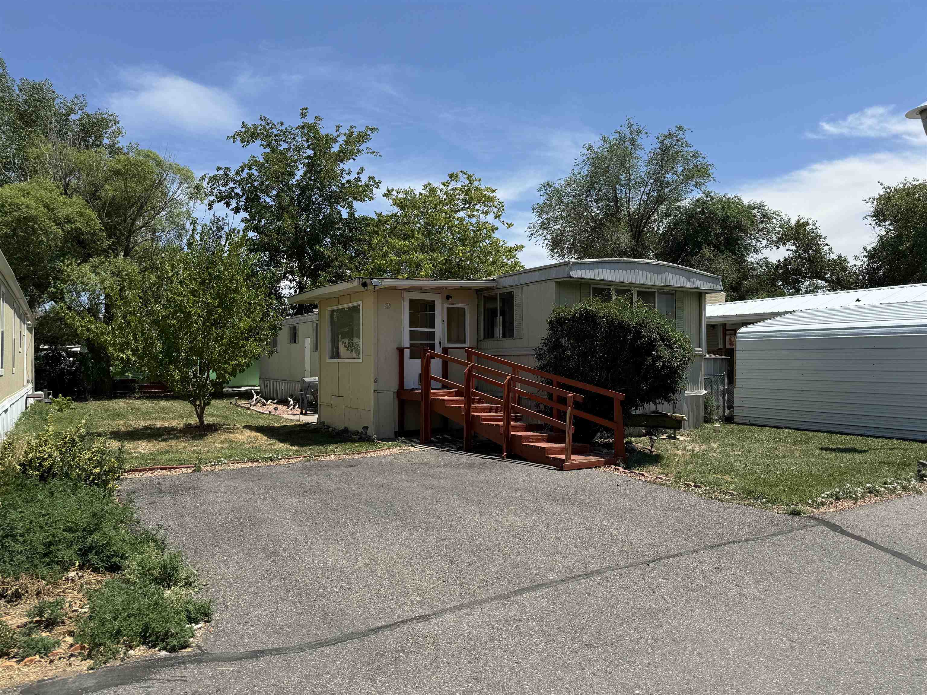 585-25 25 1/2 Road, Unit 215 Grand Junction, CO 81505 - Photo 1 of 15 a view of backyard with deck and outdoor seating