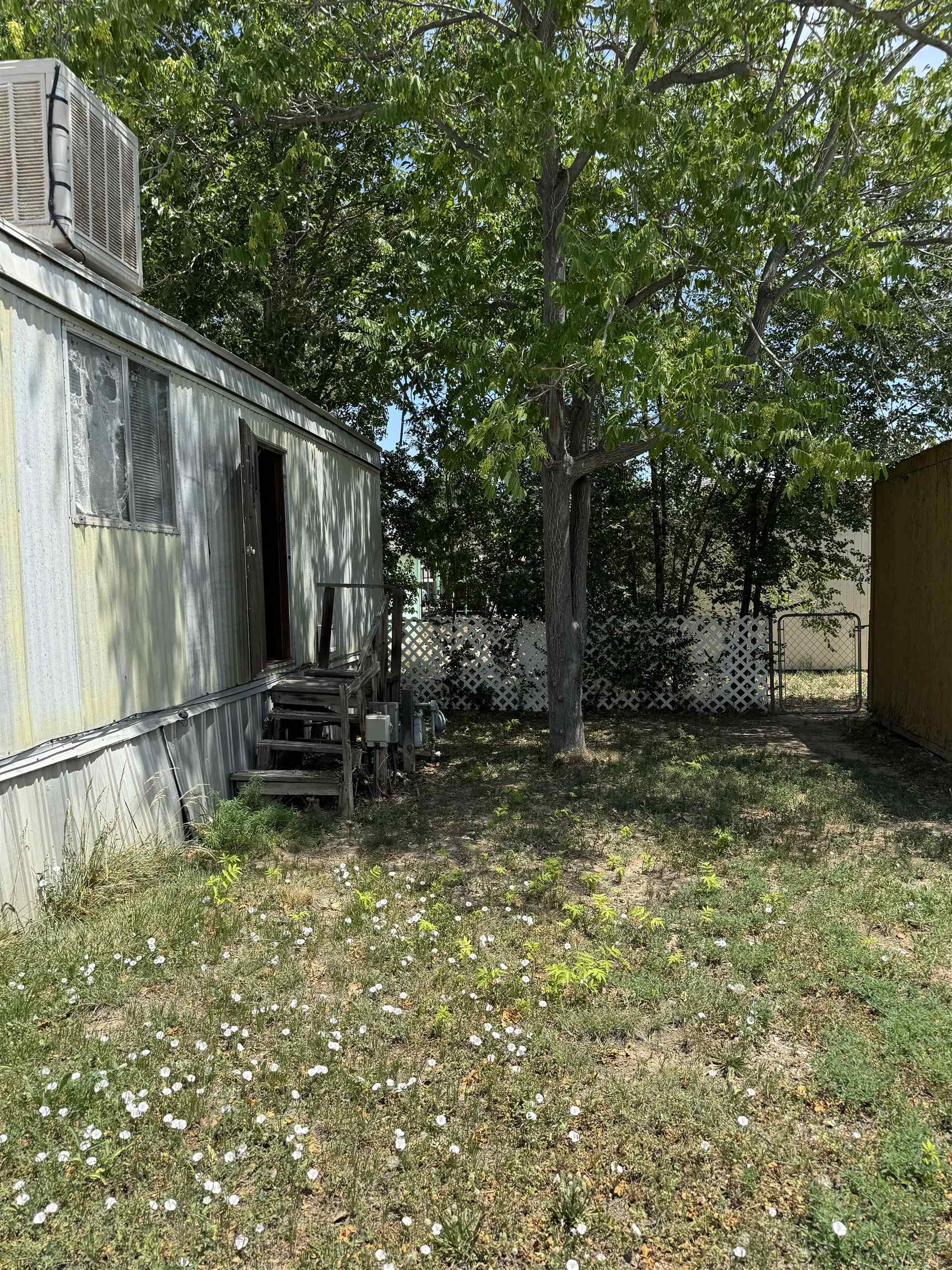 585-25 25 1/2 Road, Unit 215 Grand Junction, CO 81505 - Photo 15 of 15 a backyard of a house with barbeque oven and outdoor seating