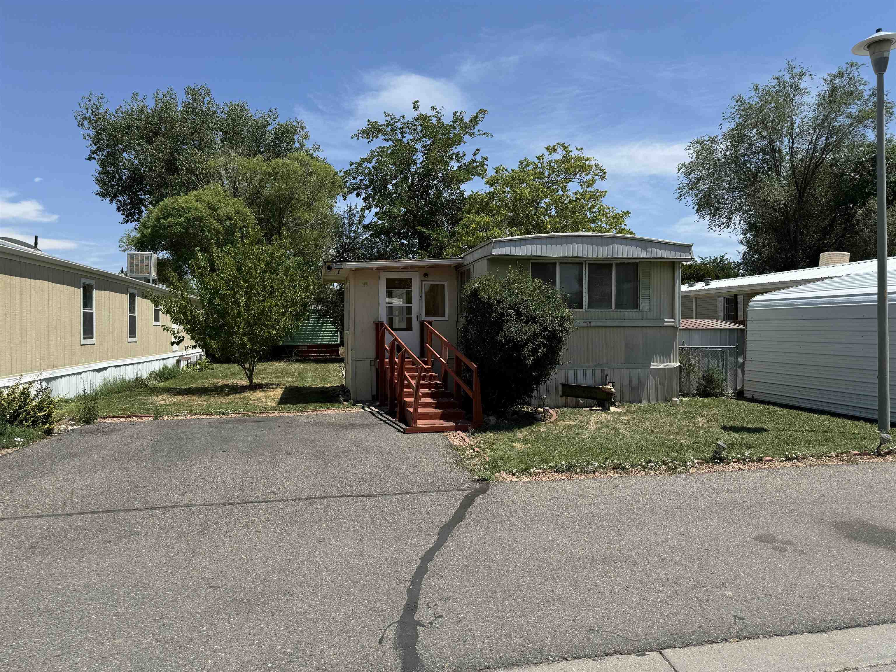 585-25 25 1/2 Road, Unit 215 Grand Junction, CO 81505 - Photo 2 of 15 a view of house with outdoor space and garden