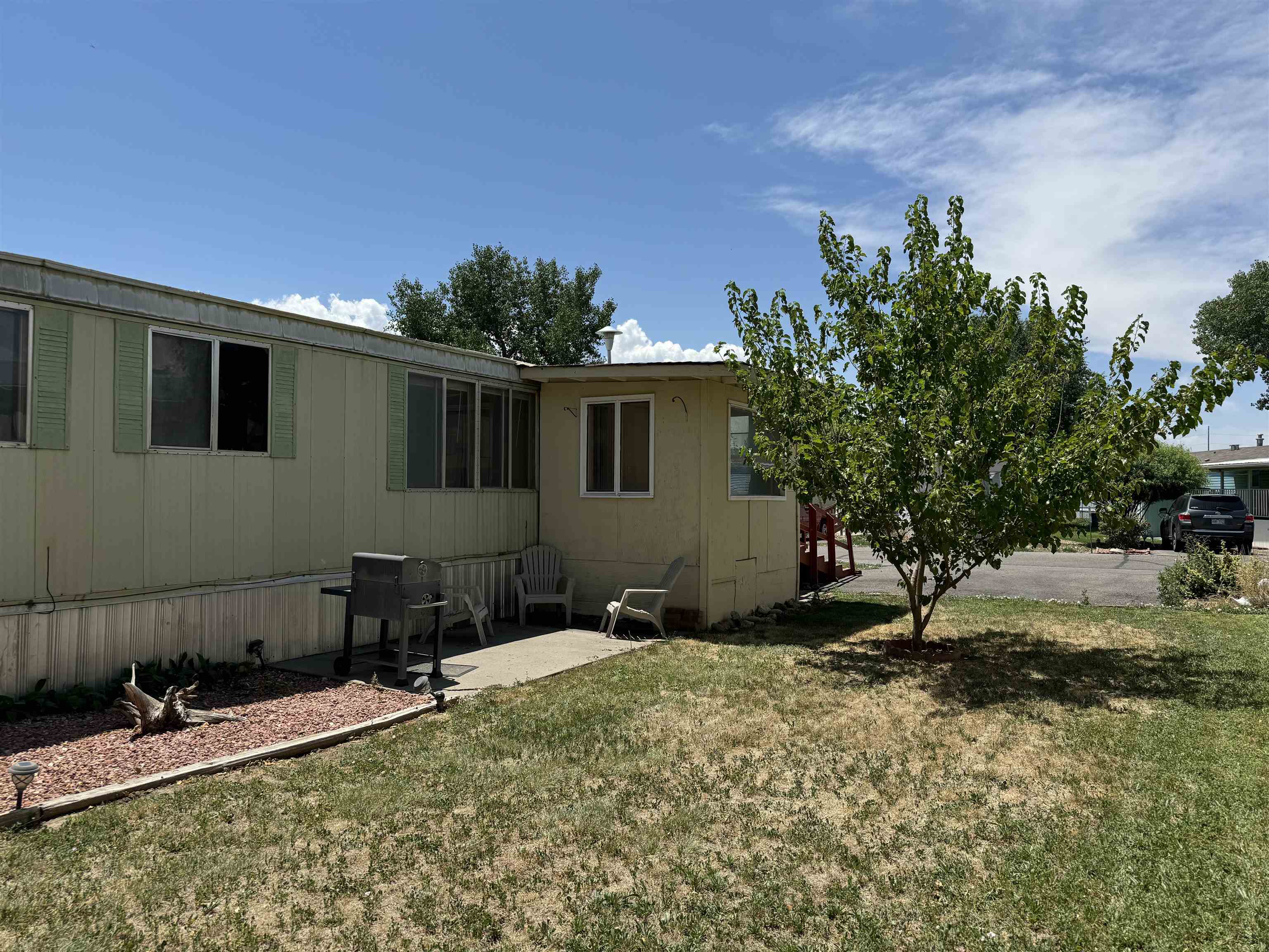 585-25 25 1/2 Road, Unit 215 Grand Junction, CO 81505 - Photo 4 of 15 a house view with a backyard space