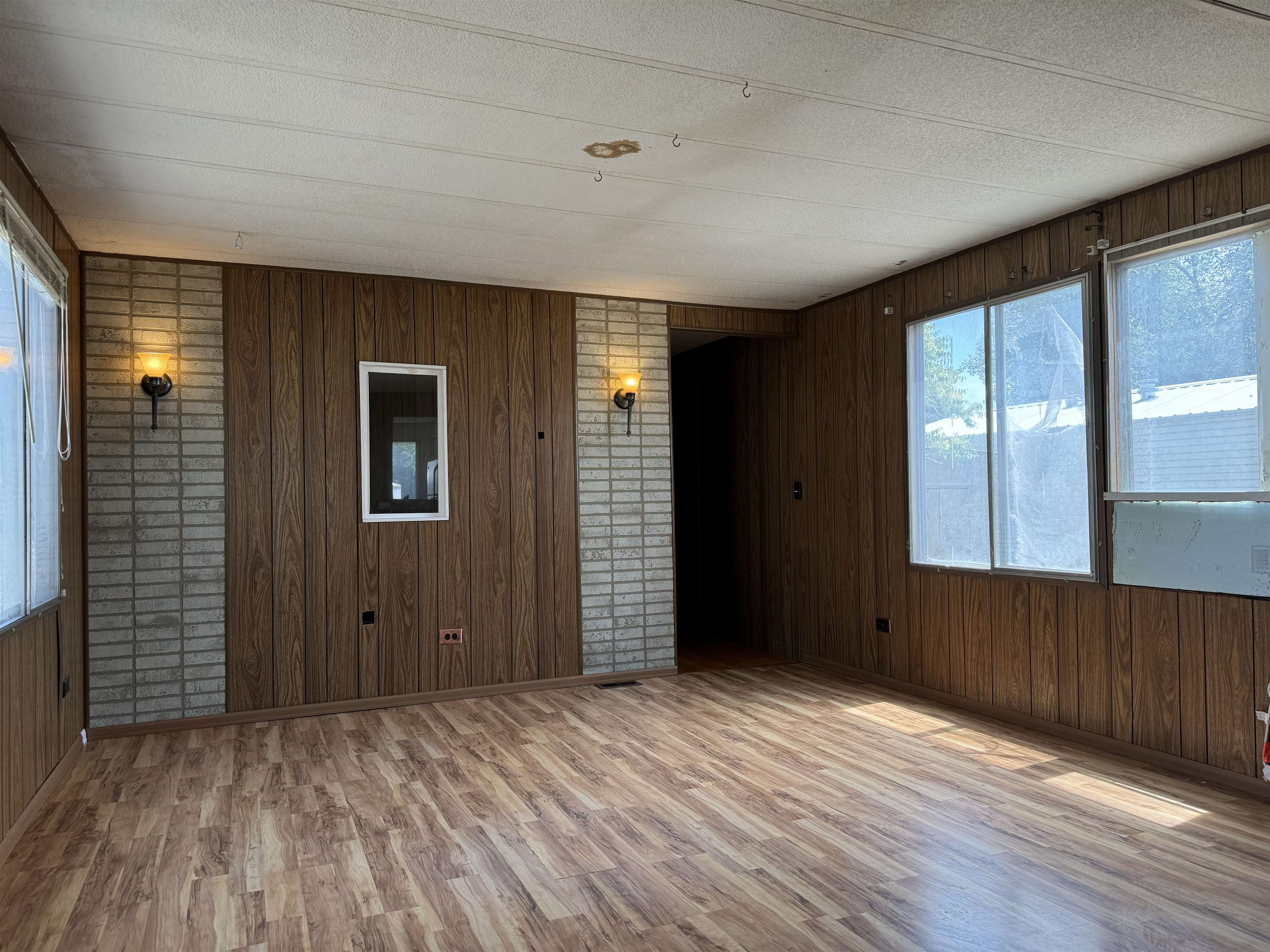 585-25 25 1/2 Road, Unit 215 Grand Junction, CO 81505 - Photo 5 of 15 a view of an empty room with wooden floor and a window