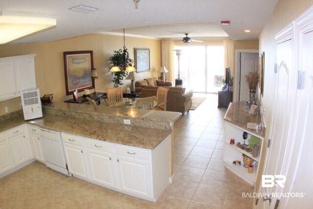 27770 Canal Road, Unit 306 Orange Beach, AL 36561 - Photo 9 of 13 Open Kitchen, Wet Bar, Dining and Living Room