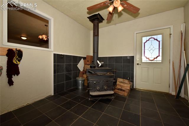 4205 Meridian Road Peyton, CO 80831 - Photo 18 of 32 wood burning stove heats master bedroom and family room. door to backyard