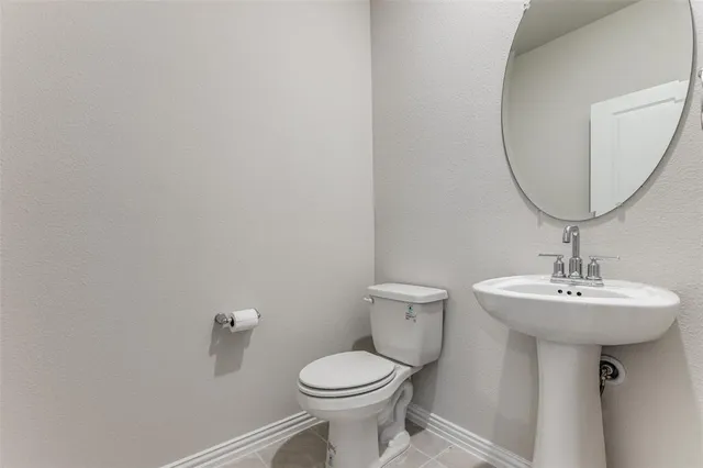 an empty room with a window and a ceiling fan