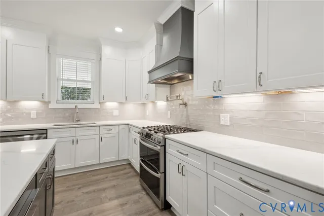 a bathroom with a granite countertop sink a toilet and bathtub