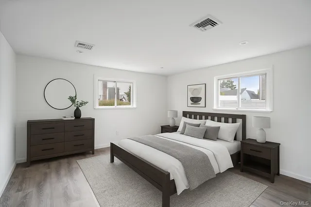 a bedroom with a bed and cabinet