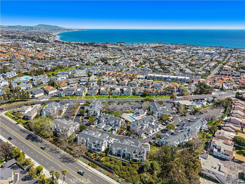 an aerial view of residential building and ocean