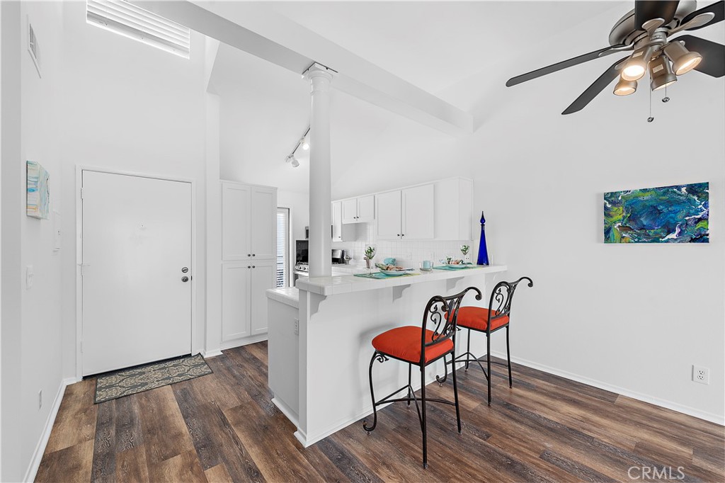 24451 Lantern Hill Drive, Unit D Dana Point, CA 92629 - Photo 7 of 32 a room with stainless steel appliances a table and chairs