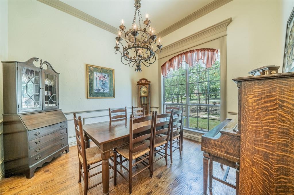109 Overton Ridge Circle Weatherford, TX 76088 - Photo 10 of 27 Formal dining feature crown molding, custom lighting.