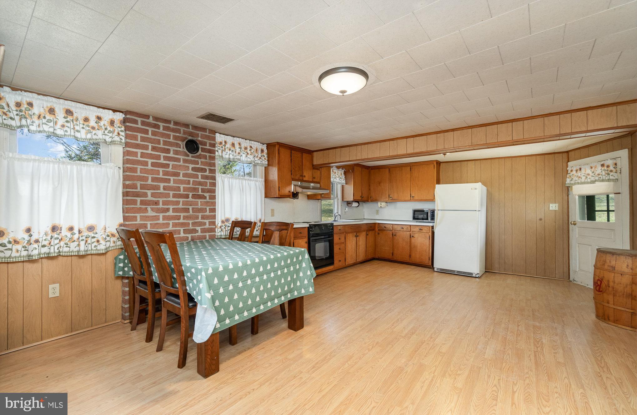 5446 Stambaugh Road Spring Grove, PA 17362 - Photo 11 of 28 Cozy kitchen with rustic charm and warmth.