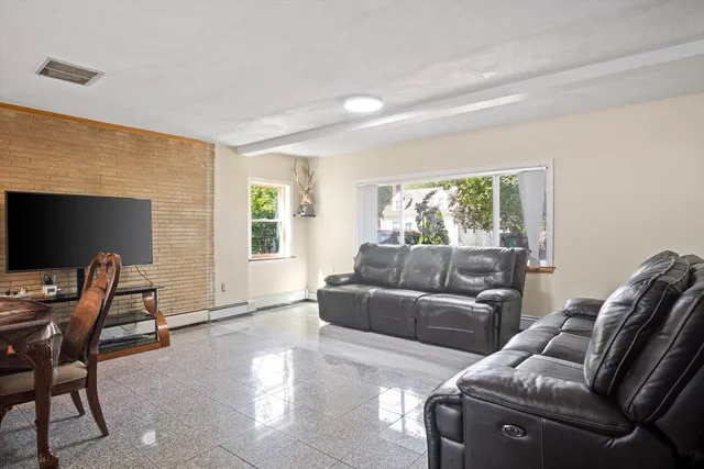 a living room with furniture and a window